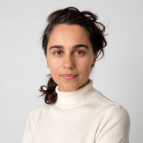 headshot of a woman wearing a white turtleneck